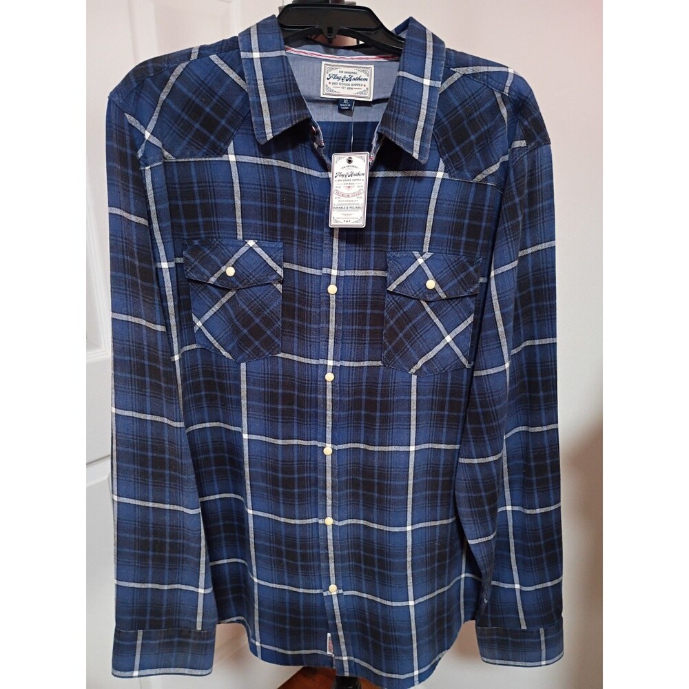 This Flag & Anthem plaid shirt features a distinctive blue and black plaid...
